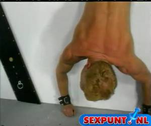 Whipping while he is hanging upside down